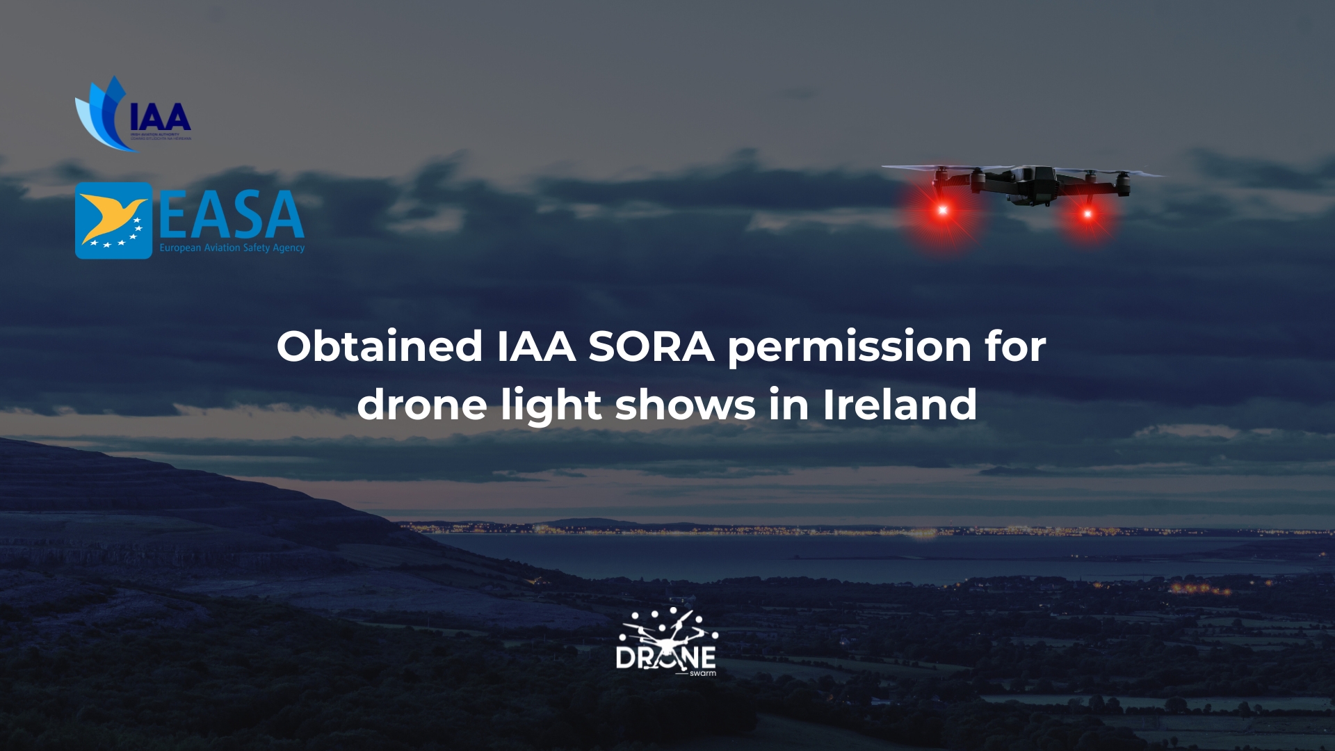 A drone hovers at dusk above hills; text reads "Obtained IAA SORA permission for drone light shows in Ireland.